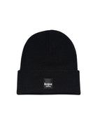 The Brewer Street Beenie in black with woven label
